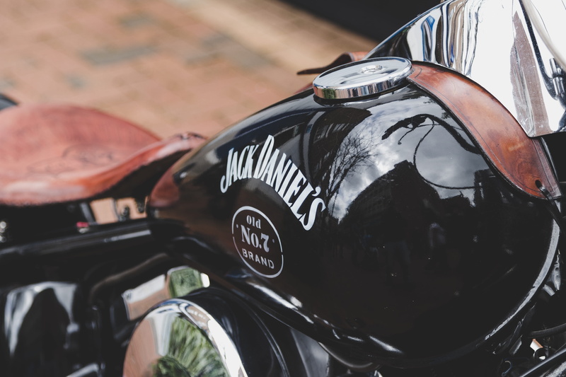 rugby, land vehicle, mode of transportation, chrome, focus on foreground, leather, stationary, hog, harley davidson, motor vehicle, motorbike, number, jd