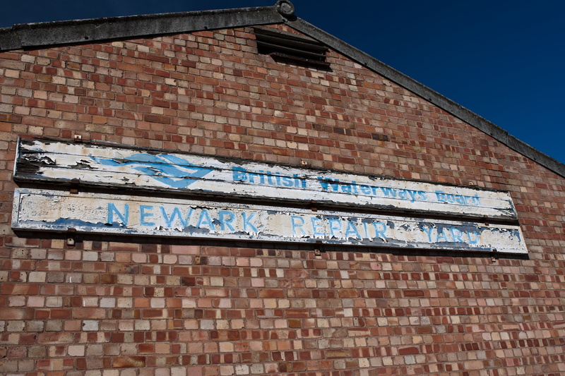 low angle view, brick, fletton bricks, sign, bricks, outdoors, wall, asbestos verge, 4K, wall - building feature, nature, flaking paintwork, pattern, repair
