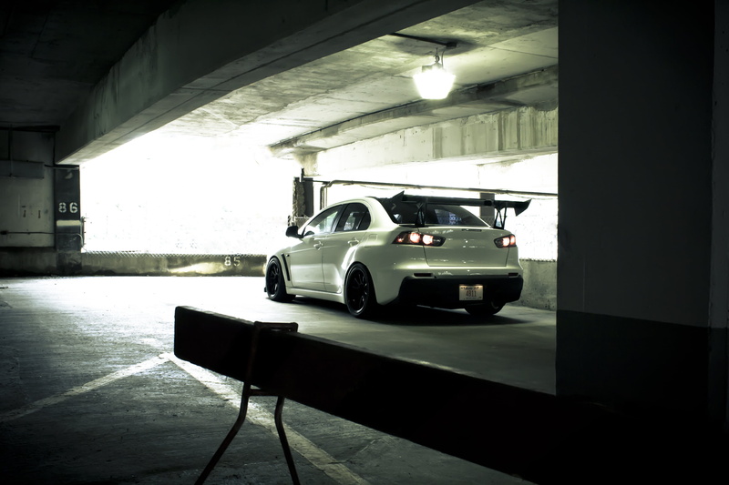 city Life, parking, lighting equipment, black And White, architecture, mode of transportation, evo x, garage, built structure, mode of Transport, parking Lot