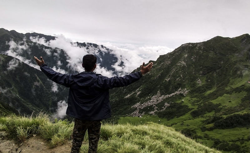 real people, one person, 2K, men, people, lifestyles, arms raised, nature, sunlight, himalyan, tranquil scene, tourism, travel, trekking, adventure, rock