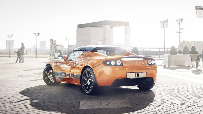 car, tesla roadster, street, sunlight, land vehicle, nature, city, outdoors, day, wealth, road, transportation, incidental people, 2K, building exterior
