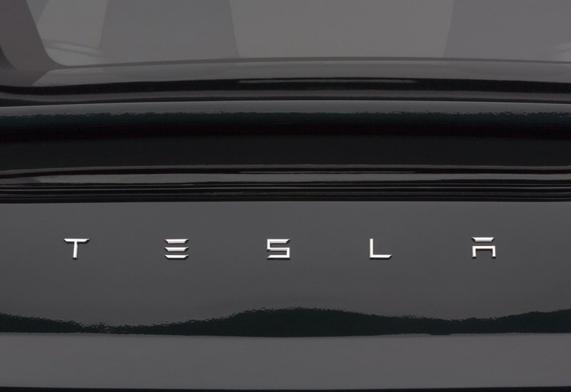 white color, night, nature, lighting equipment, built structure, in a row, water, no people, tesla, outdoors, beauty in nature, illuminated, roadster, architecture