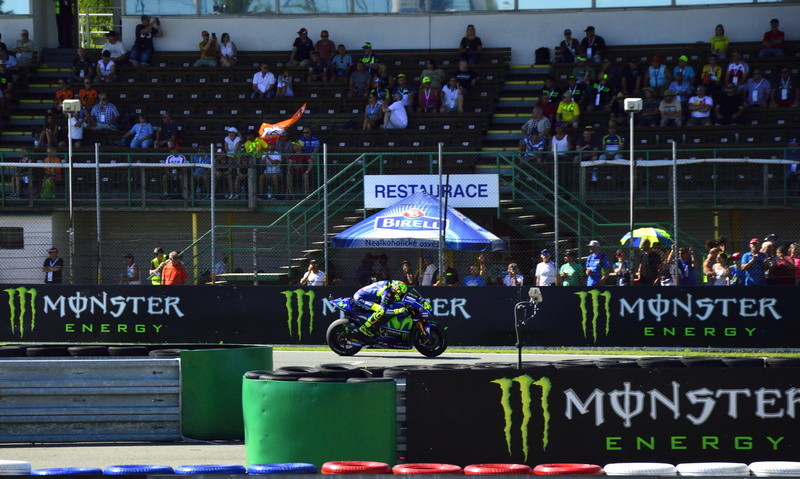 western script, arts culture and entertainment, communication, real people, occupation, performance, text, brno, motogp, men, crowd, sign, motorsport, outdoors