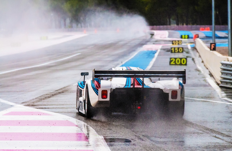 mode of transportation, motor vehicle, water, motion, competition, motor racing track, transportation, car martini racing, outdoors, sport, rain, road