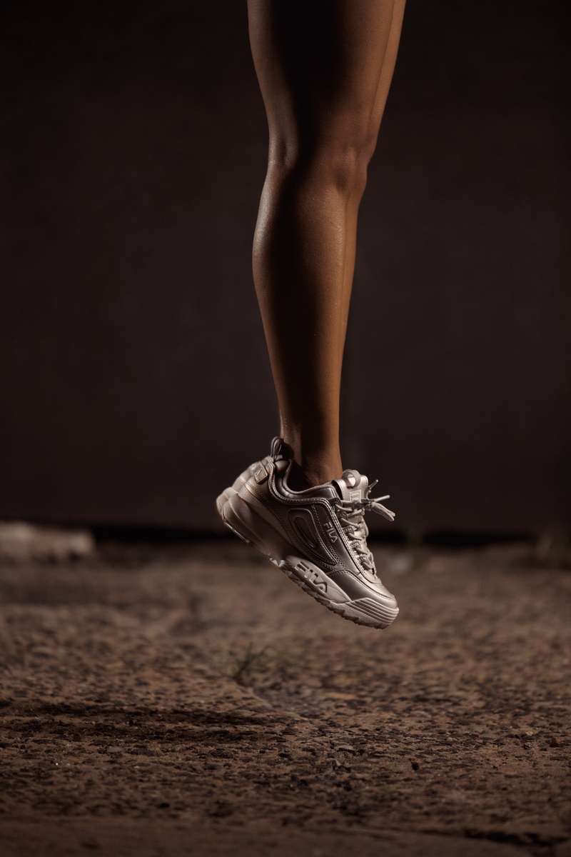 one person, walking, shoe, indoors, jump, apparel, tiptoe, dancing, low section, muscles, exercise, filas, limb, standing, human foot, sport, balance, ankle