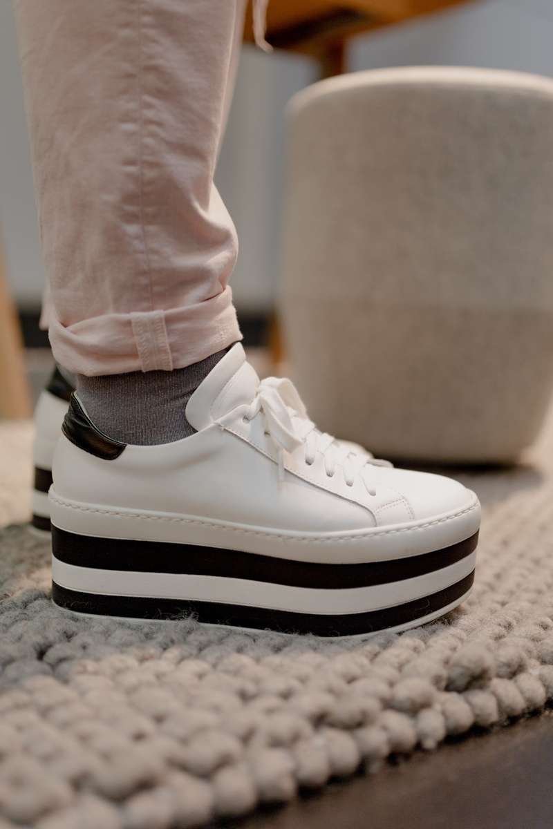 sitting, close-up, low section, human limb, 4K, white suede, human foot, jeans, white shoes, shoelace, shoe, selective focus, men, white, pink, real people