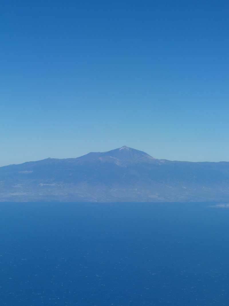 tranquility, mountain range, blue, island, volcano, scenics - nature, beauty in nature, nature, water, sky, clear sky, copy space, mountain, idyllic, remote