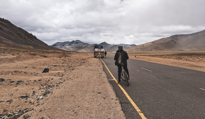 deserted, scenics - nature, bicycle, road, outdoors, landscape, person, riding, 4K, mountain, remote, desert, traveller, day, cyclist, environment, dirt road
