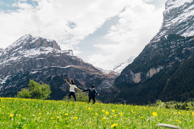 holding hands, highlands, tranquility, real people, outdoors, mountain peak, cloud - sky, leisure activity, green, flowers, woman, 5K, standing, mountains