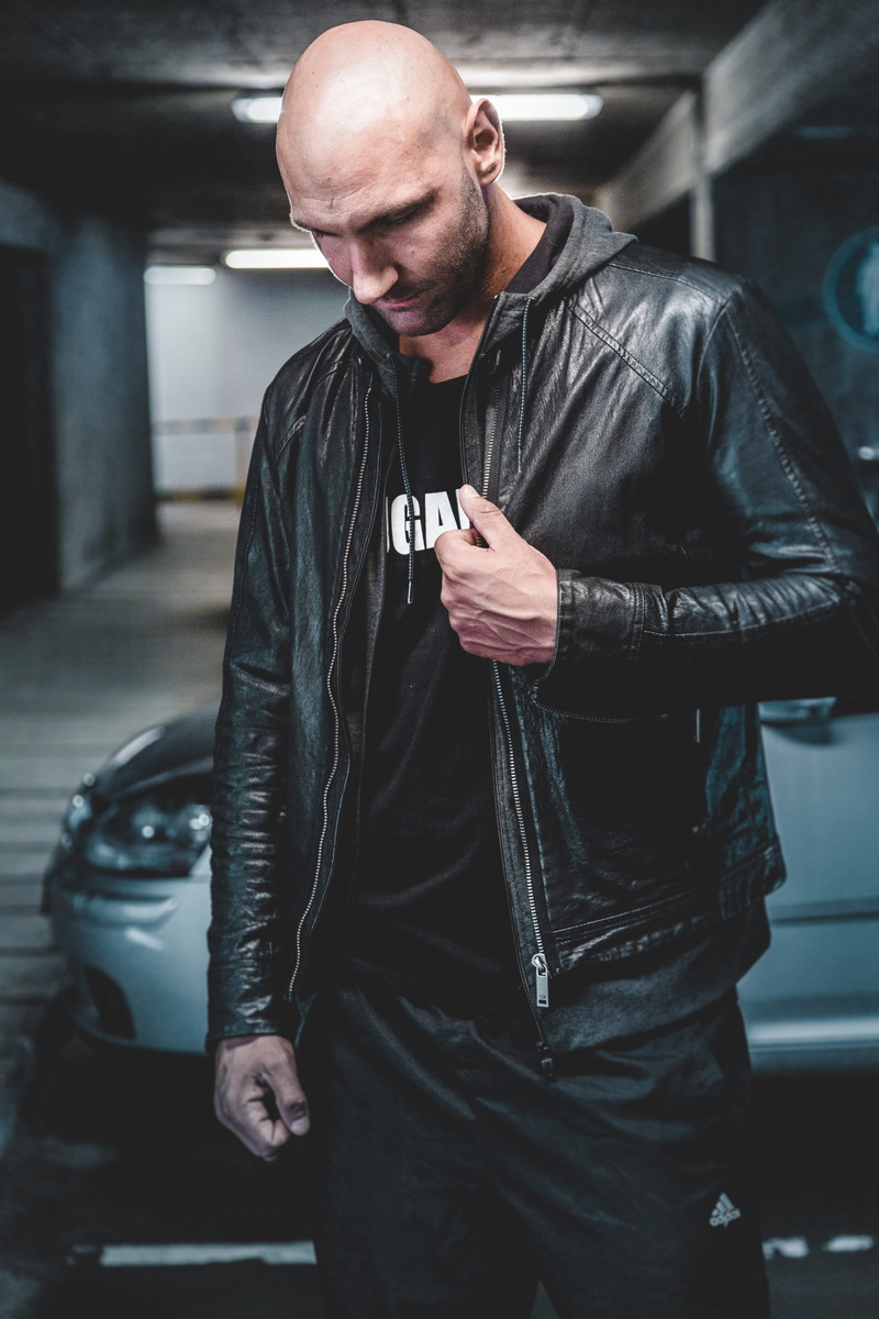 land vehicle, young men, lights, transportation, fashion, wearing, three quarter length, jacket, wear, mode of transportation, garage, motor vehicle, lifestyles