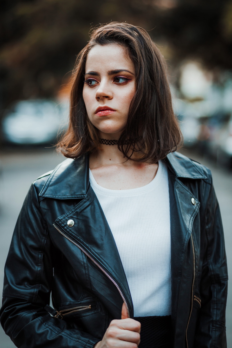 focus, photoshoot, focus on foreground, hair, casual clothing, fashion, woman, lady, pretty, leather jacket, choker, front view, portrait, black leather jacket