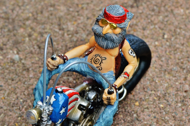 focus on foreground, joy of life, high angle view, man, jeans, tattooed, casual, sunlight, funny, two wheeled vehicle, representation, male likeness, cool