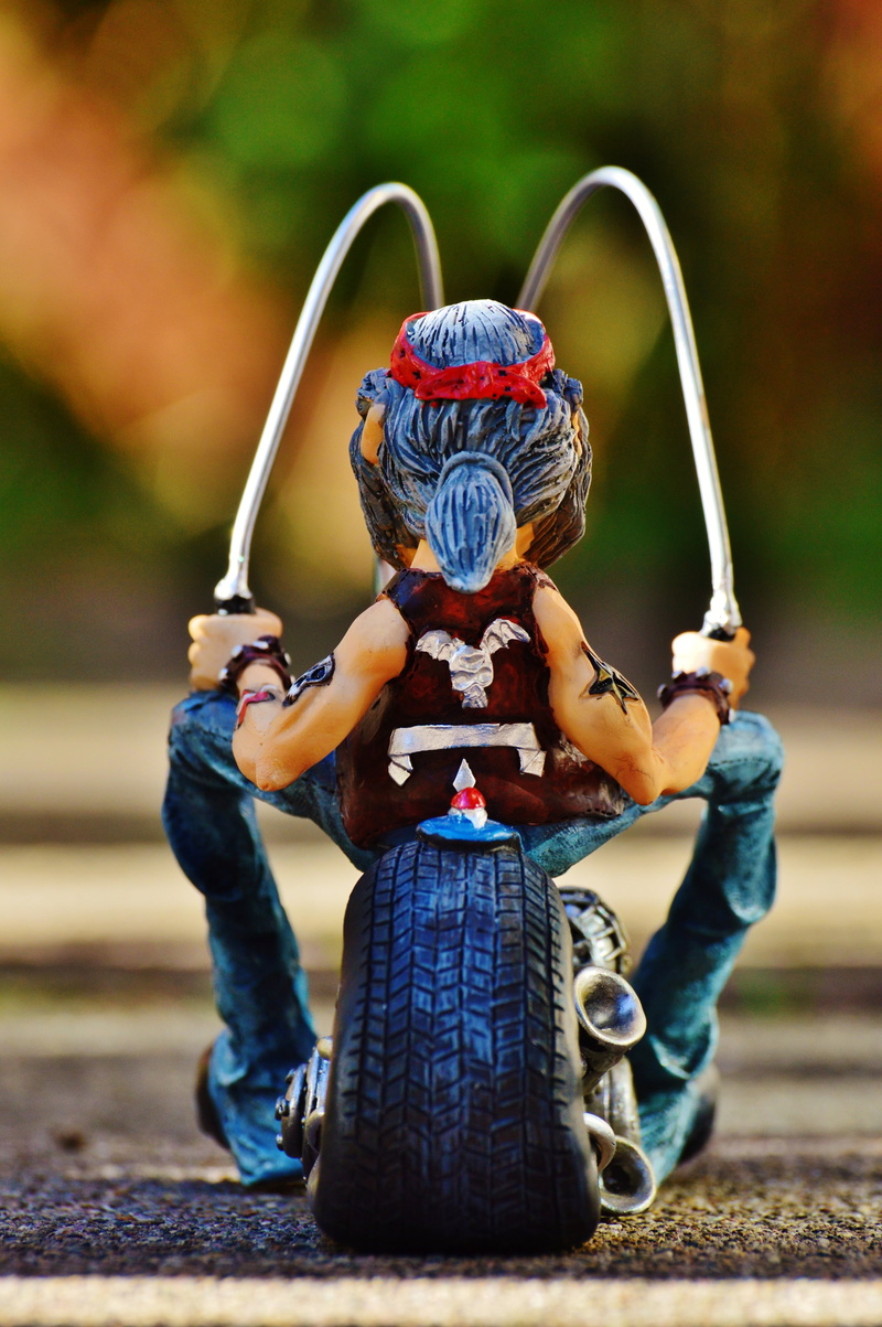 male likeness, biker, plastic, alien, fun, warrior, child, creativity, two wheeled vehicle, representation, arms raised, holding, human representation