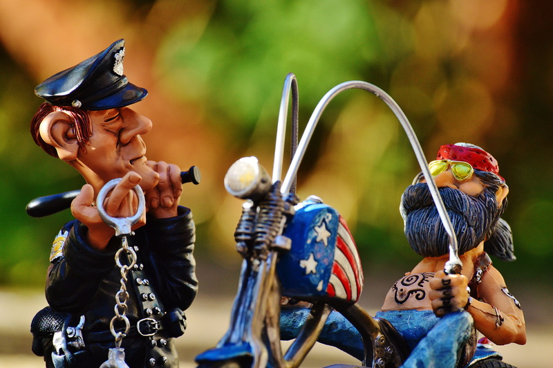policewoman, tattooed, figure, funny, multi colored, human representation, male likeness, weapon, creativity, outdoors, offspring, childhood, cop, figurine