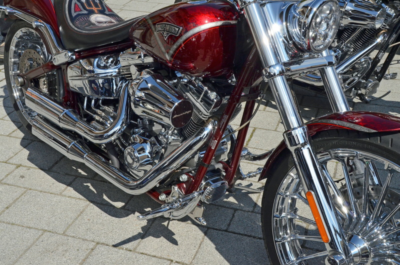 motorcycle, wheel, travel, red, mode of transportation, transportation, spoke, road, cult, two wheeled vehicle, high angle view, metal, day, close-up, hobby