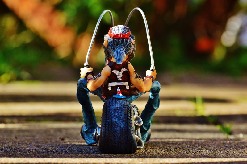 road, nature, sunlight, holding, full length, toy, dom, focus on foreground, jeans, person, adult, sitting, day, leisure activity, biker, tattooed, 4K