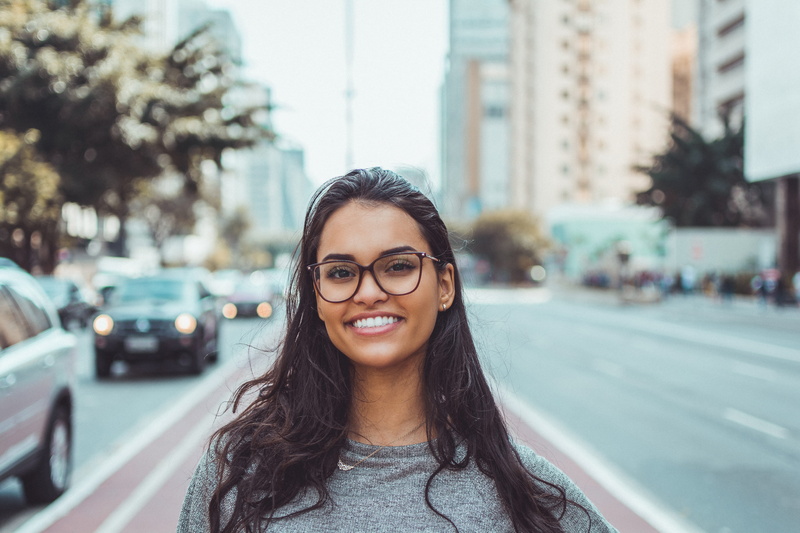 wear, glasses, front view, photoshoot, landscape, beautiful woman, looking at camera, beautiful, daytime, motor vehicle, person, downtown, urban, young women
