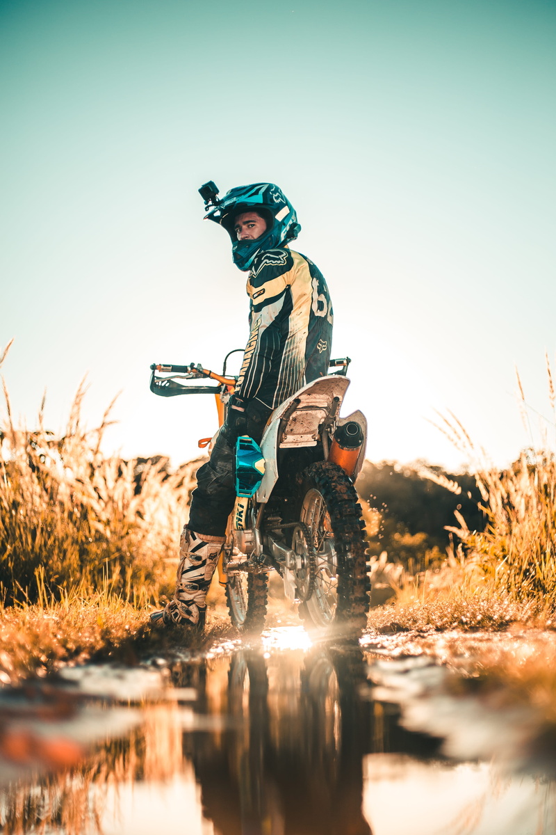 nature, one person, man, real people, sunset, clear sky, transportation system, men, road, riding, dirt bike, outdoors, biker, ride, person, leisure activity
