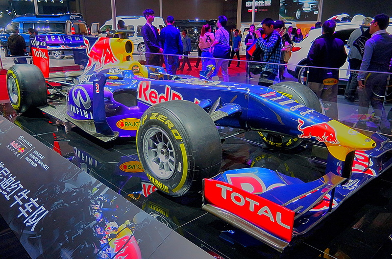 bull, street, formula 1, incidental people, red bull, red, text, group of people, car, racing, western script, car show, multi colored, land vehicle, real people
