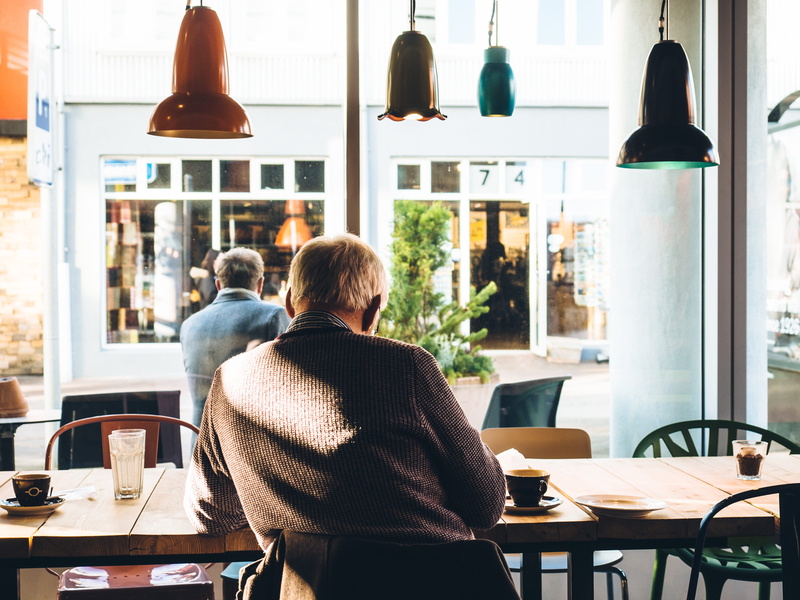 indoors, cafe, day, restaurant, window, hairstyle, adult, man, business, beside, women, chair, rear view, sitting, warm clothing, table, lifestyles, electric lamp