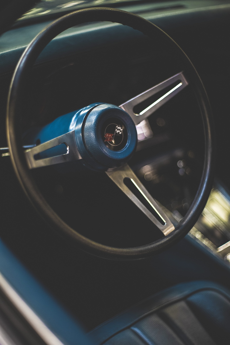 design, radiator, focus on foreground, style, car, day, silver colored, land vehicle, metal, indoors, geometric shape, steering, black, transportation