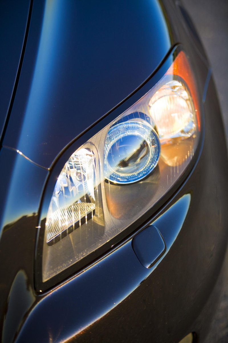 extreme close-up, motor vehicle, lighting equipment, transportation, wealth, headlight, vehicle light, close-up, vehicle mirror, glass - material, shiny