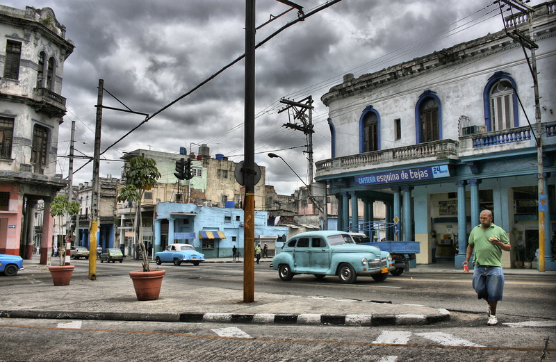 4K, full length, land vehicle, one person, street, cars, sky, cuba, building exterior, road, walk, building, city street, havana, people, cloud - sky