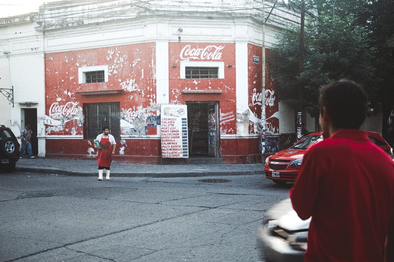women, walking, beside, city, incidental people, person, uniform, coca, rear view, red, 2K, full length, group of people, apron, text, real people, coca cola