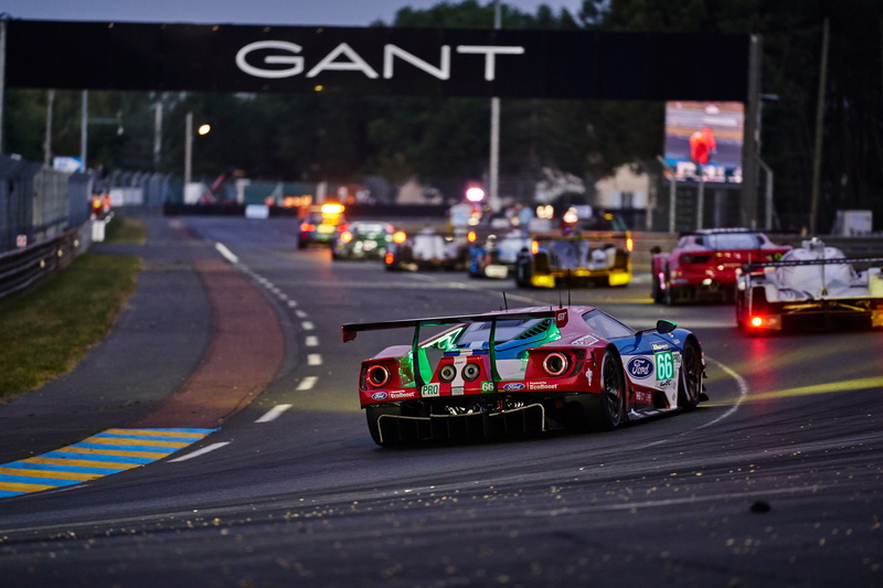 transportation, sign, street, car, no people, illuminated, road sign, motor vehicle, road, text, motor racing track, motion, multi colored, land vehicle