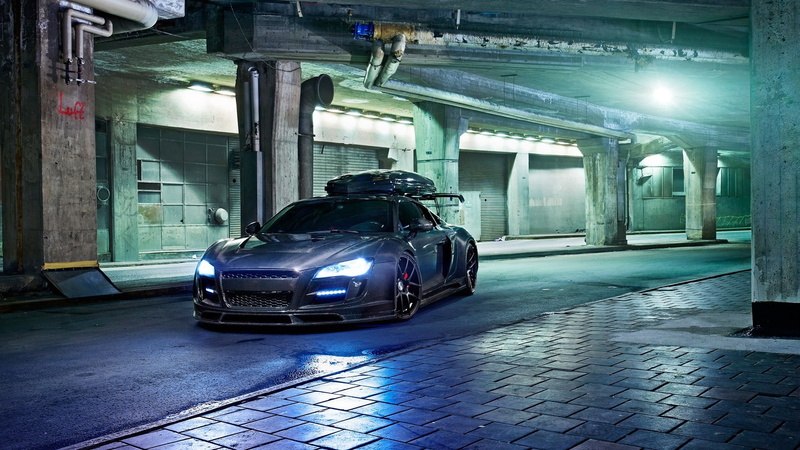 Audi, lighting equipment, garage, street, building exterior, night, city, architectural column, stationary, parking, no people, illuminated, the way forward
