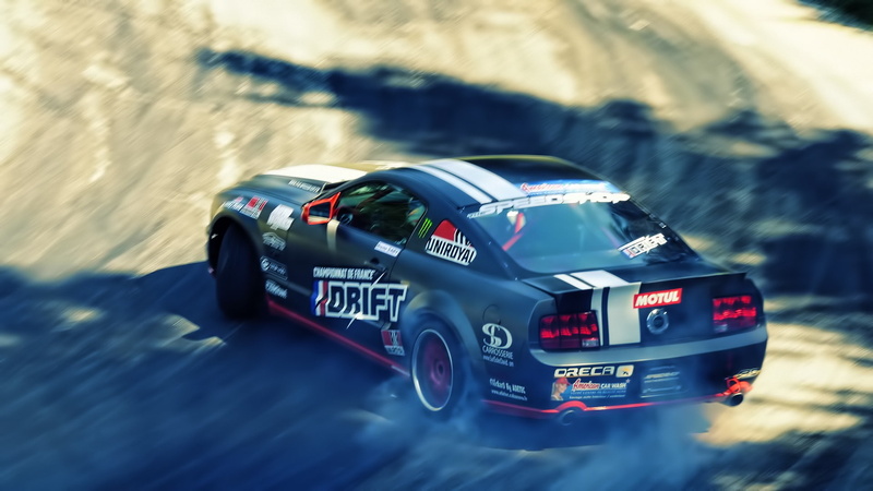 drift, toy, sunlight, car, motion, day, transportation, competition, motor vehicle, sports race, Ford Mustang GT, selective focus, blurred motion, security