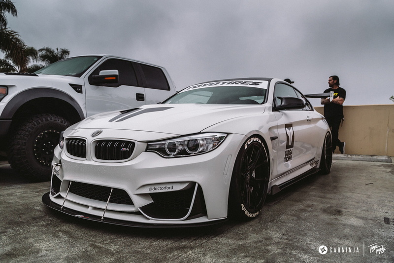 side view, BMW M4 Coupe, sky, day, sports car, one person, Carninja, real people, car, luxury, transportation, low, 2K, land vehicle, mode of transportation