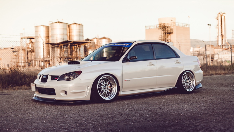 road, silver colored, wheel, luxury, land vehicle, building exterior, Subaru, sky, transportation, city, white cars, motor vehicle, Stance, black color