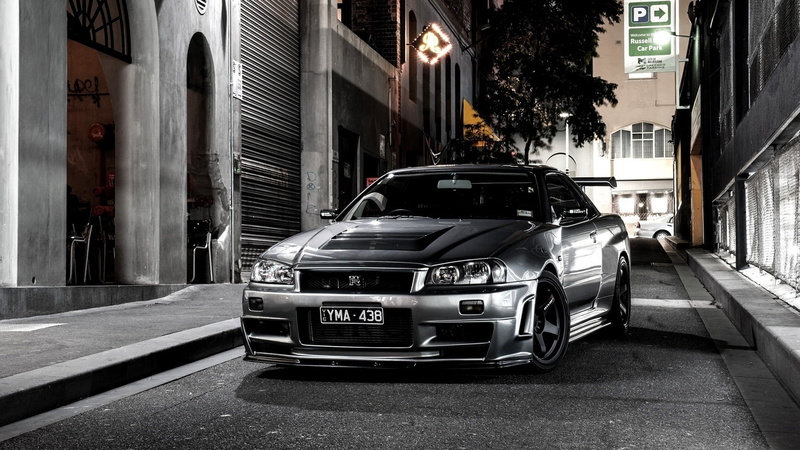 speed, motor vehicle, british Culture, mode of Transport, headlight, motion, grille, black, compact Car, building Exterior, incidental people, road, transportation