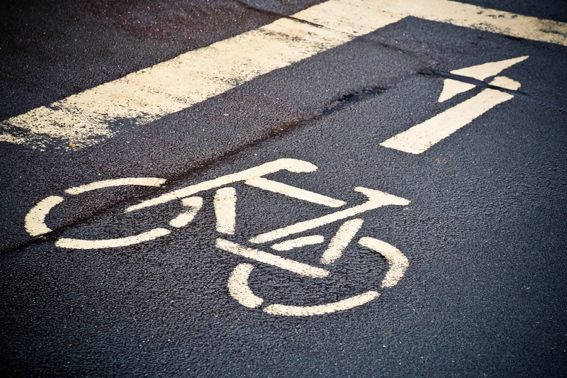 no people, day, drive, line, asphalt, information, characters, safety, traffic, arrow, message, road sign, bicycle lane, note, directory, transportation