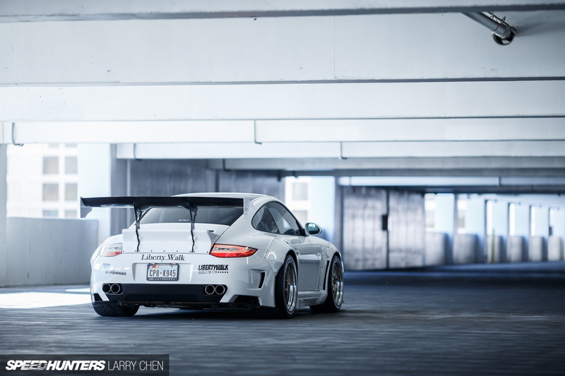 motor racing track, indoors, garage, transportation, copy space, speed, land vehicle, sports race, communication, parking garage, sport, mode of transportation