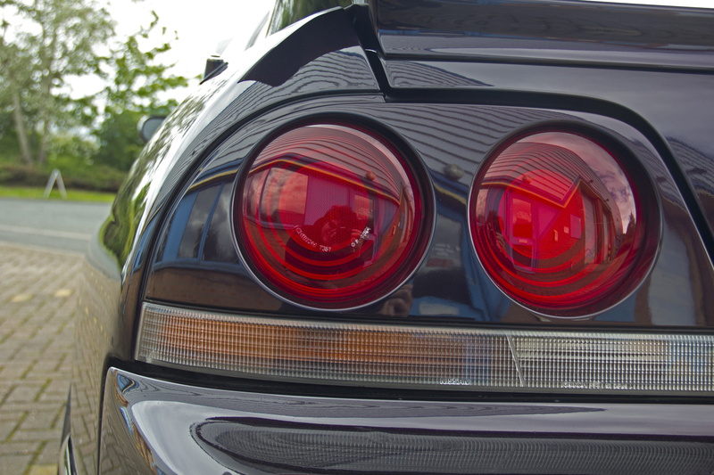 nature, city, transportation, chrome, car, tail light, focus on foreground, nissan skyline gt r r33 car, no people, red, glass - material, stationary, mode of transportation