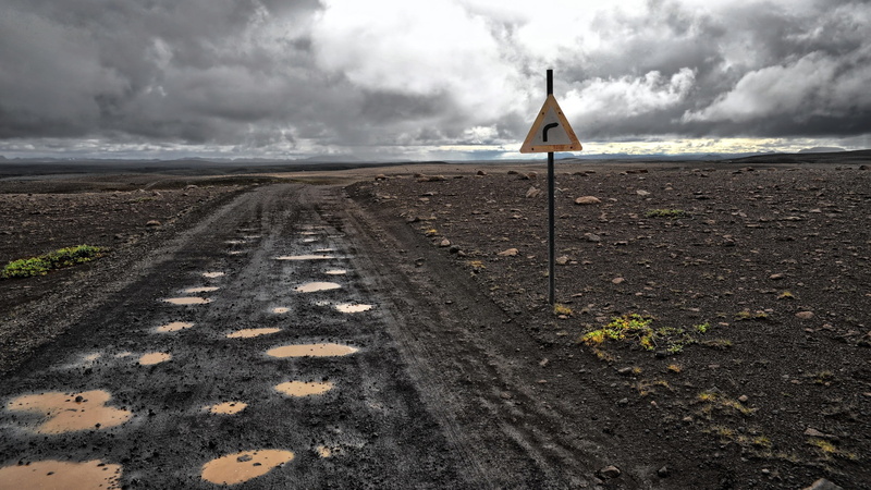board, signage, water, road, dirt road, 2K, storm cloud, scenics - nature, flag, day, transportation, communication, direction, sign, no people, environment