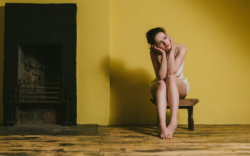 chair, emotion, beauty, wall, 720P, young adult, yellow, hairstyle, adult, shirtless, beautiful woman, barefoot, seat, front view, indoors, clothing, women