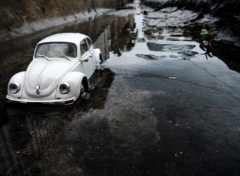 rain, flooded, reflection, car, toy, mode of transportation, road, volks wagen, water, white, wet, miniature, mud, automobile, no people, transport, vehicle
