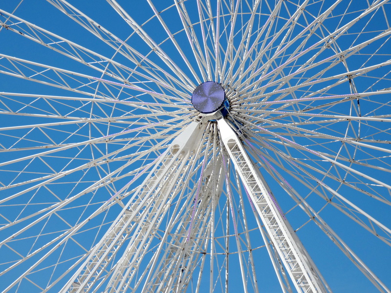 outdoors, traveling carnival, spoke, steel, low angle view, amusement park, attraction, wheel, leisure activity, rays, park, sky, ferris wheel, structure