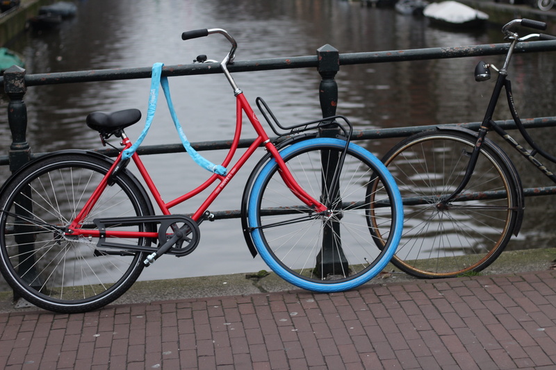 railing, metal, brake, no people, colorful, holidays, safety, footpath, bicycles, vehicle, day, blue, wheel blue, sport, animation, sidewalk, parking, outdoors