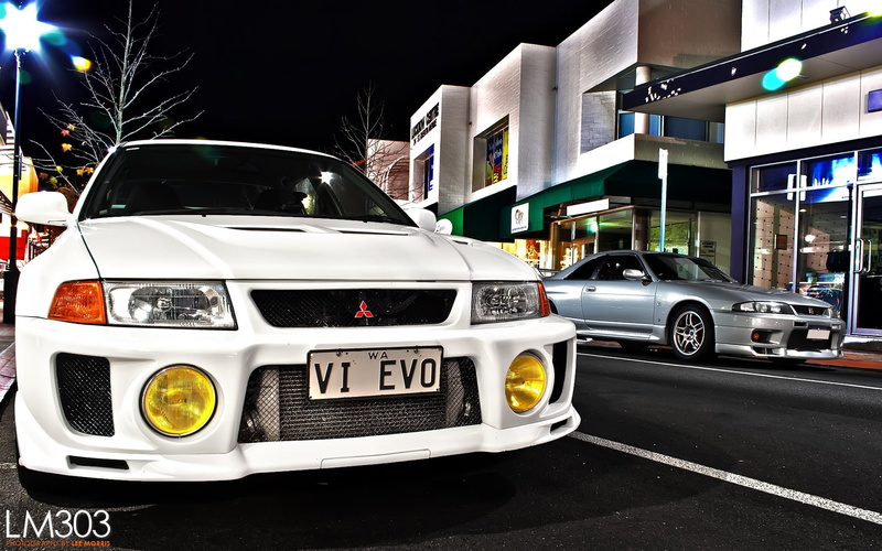 motor vehicle, parking, night, no people, motion, road, stationary, mode of transportation, building exterior, nissan nissan skyline gt r r33 nissan skyline r32 nissan skyline gt r r34 nissan skyline gt r r35 car
