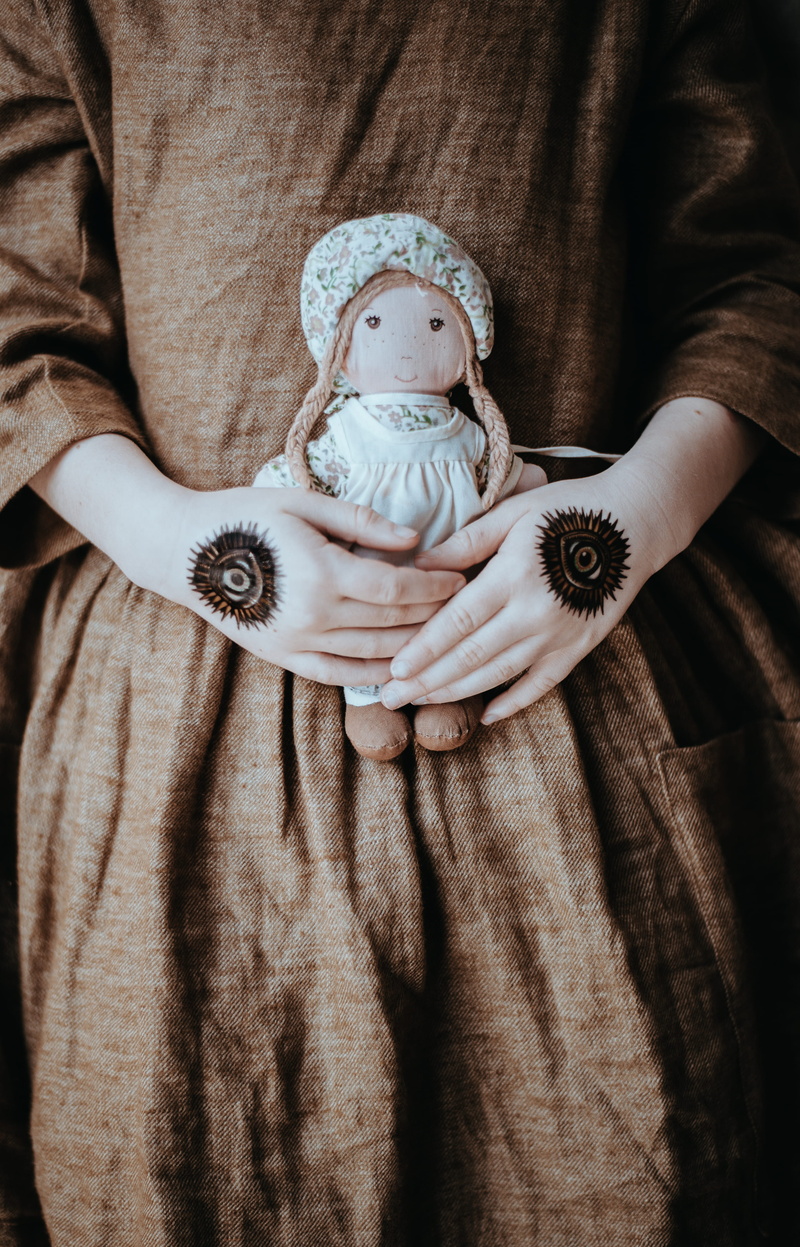 child, women, people, baby, childhood, innocence, indoors, clothing, girls, real people, human representation, family, representation, person, voodoo, holding
