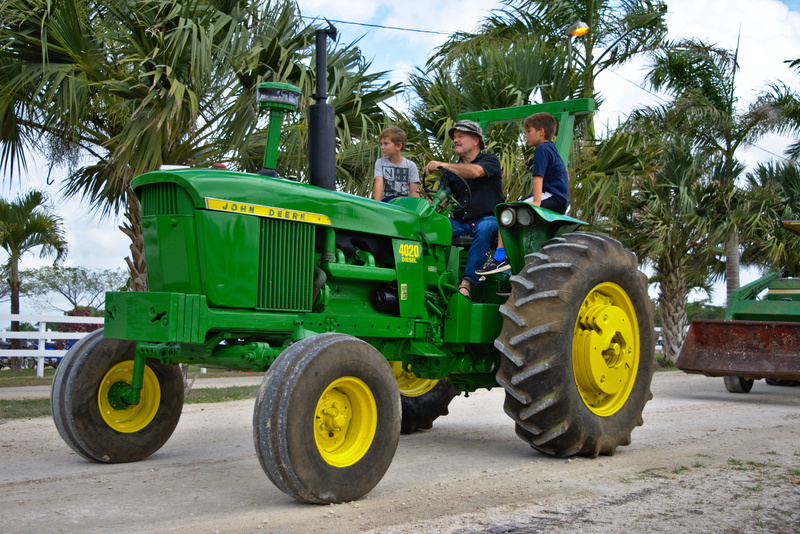 group of people, 5K, spanish lookout, real people, adult, portrait, tractor, machine, anniversary, mode of transportation, wheel, green color, outdoors