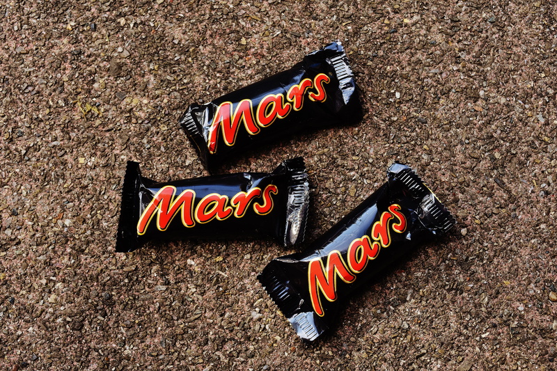 multi colored, mars, event, candy bar, still life, text, information, chocolate, sign, 5K, communication, directly above, no people, sweet, government