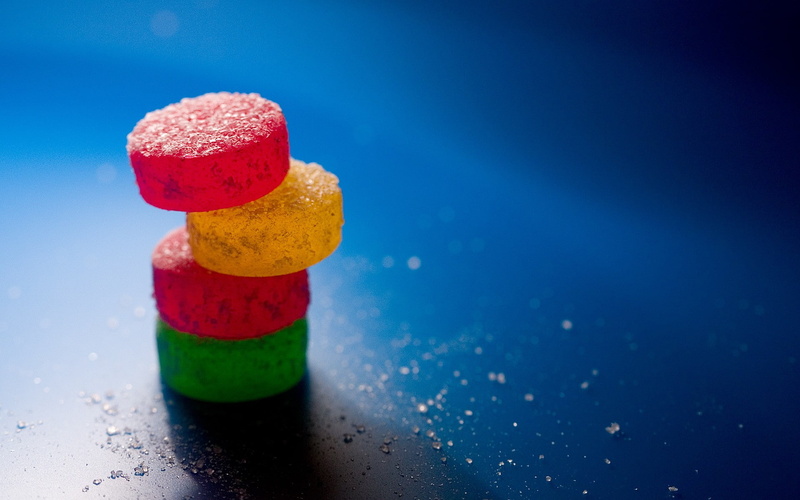 table, multi colored, candies, blue, 1080P, dessert, macro, red, copy space, stack, food and drink, indulgence, sweets, food, sweet food, blue background