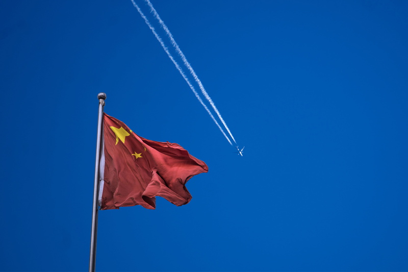 emotion, environment, blue, travel, flying, shanghai, chinese, white, vapor trail, copy space, china, national icon, red, low angle view, outdoors, wind