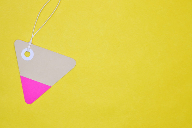 no people, lace, yellow background, hanging, drilling, color, tag, reminder, single object, label, multi colored, trade, wall - building feature, figure