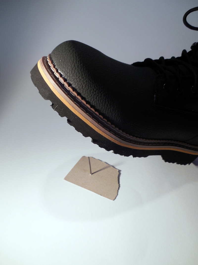 low section, work clothes, accidents at work, hat, foot, cold temperature, winter, working footwear, high angle view, nail, studio shot, injury, paper